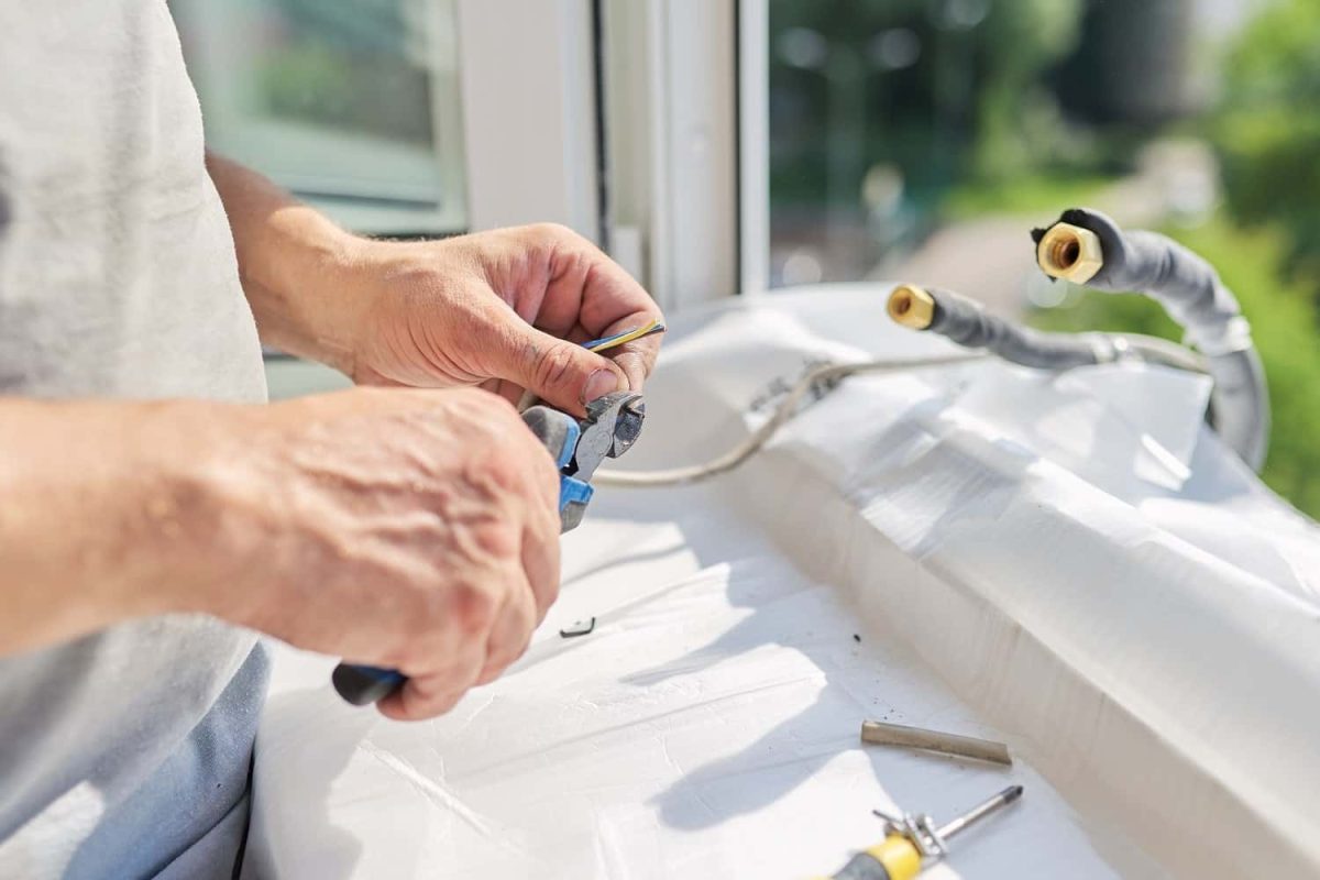 installing-an-air-conditioner-in-an-apartment-offi-2021-12-09-22-09-23-utc-min-min.jpg