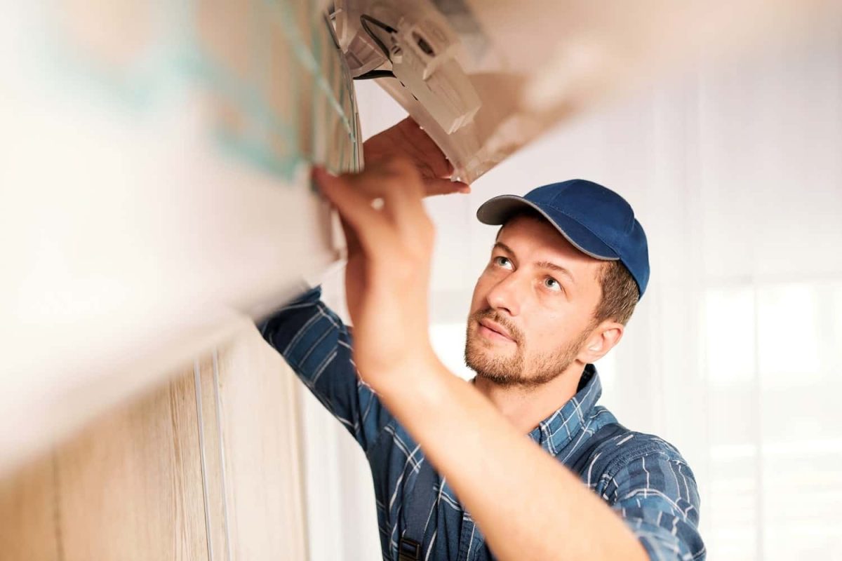 young-workman-in-workwear-trying-to-find-out-reaso-2021-09-24-03-09-38-utc-min-min.jpg